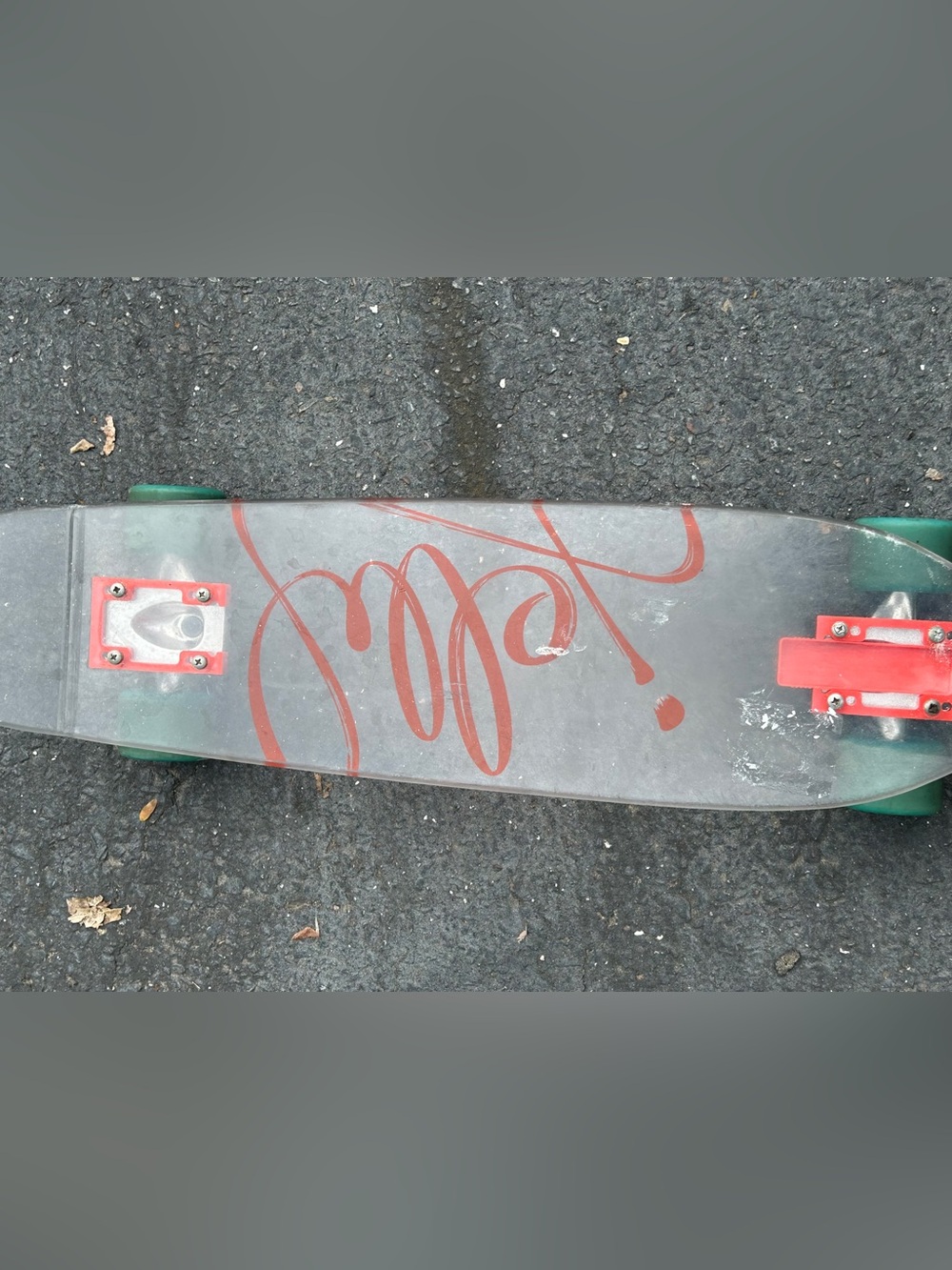 Clear Deck Cruiser Skateboard with Red Script Graphic